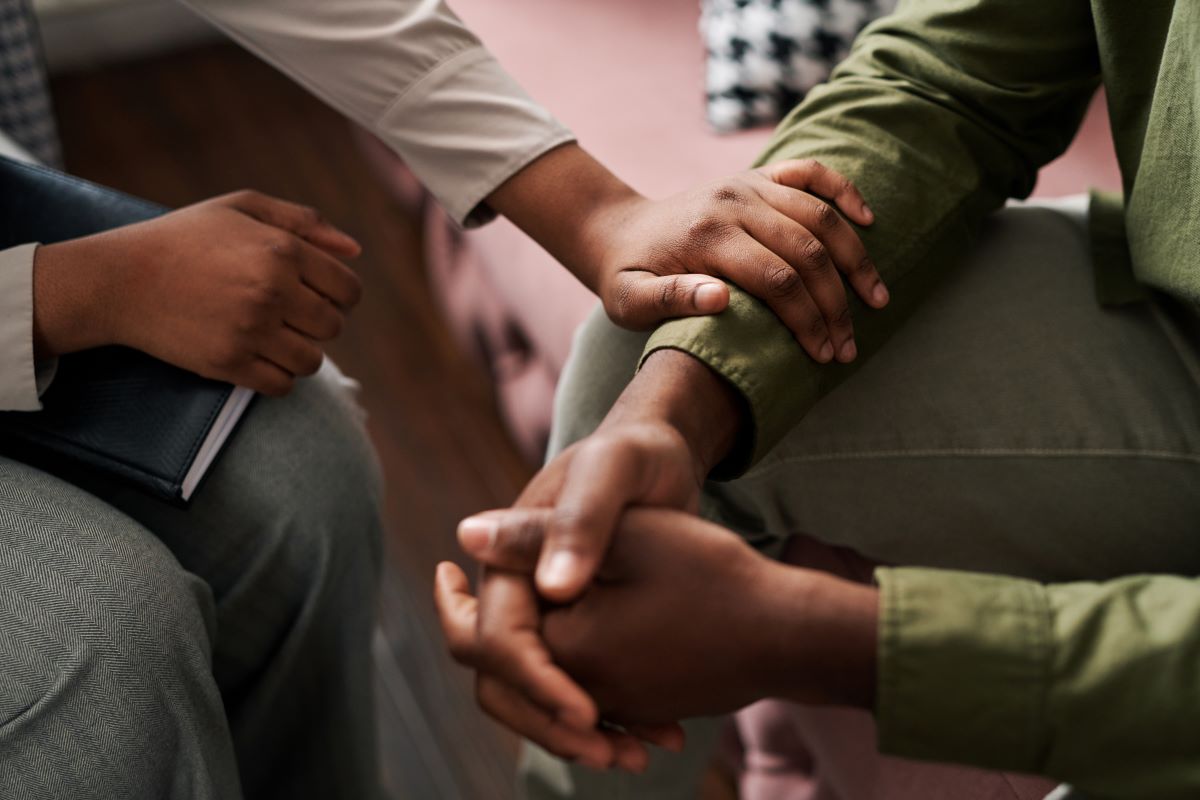 Person being supported by another person