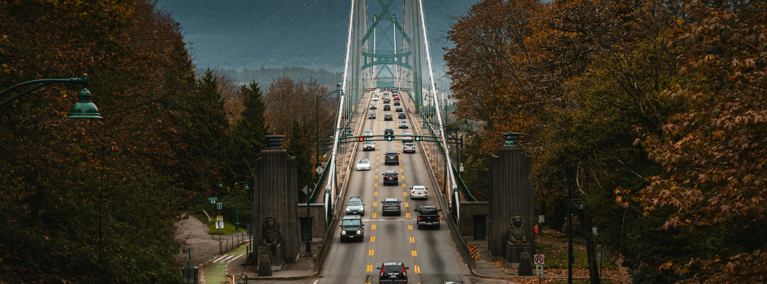 Vehicles driving across the Lions Gate Bridge in Vancouver, representing everyday driving conditions covered by BC auto insurance from Westland Insurance.