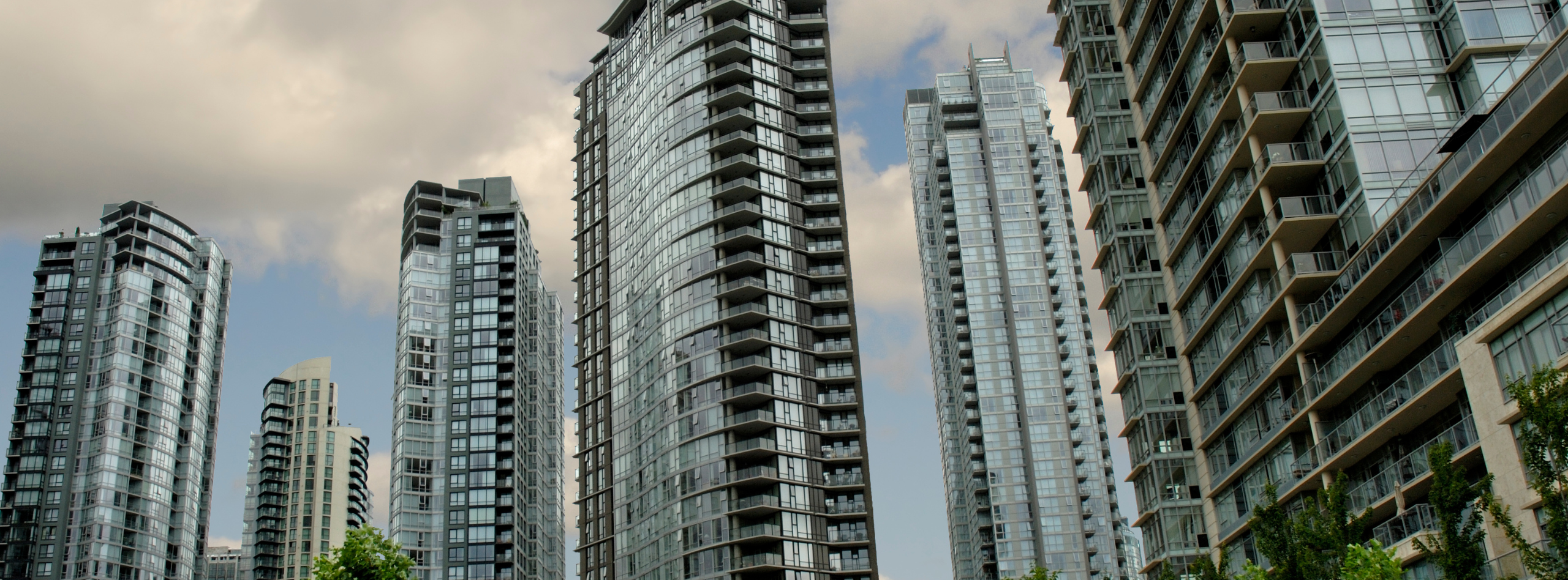 High-rise condo towers in British Columbia with glass balconies, representing the types of homes protected by BC condo insurance from Westland Insurance.